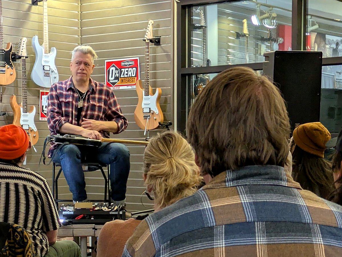 A clinic at Guitarworks, the room listening